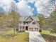 Charming two-story home with well-manicured lawn, covered front porch, and two-car garage at 105 Oakfield Way, Douglasville, GA 30134