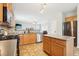 Open kitchen featuring stainless steel appliances, stone countertops, and center island at 105 Oakfield Way, Douglasville, GA 30134