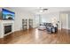 Comfortable living room with fireplace, TV, and hardwood floors, perfect for relaxing at 105 Oakfield Way, Douglasville, GA 30134
