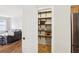 Open walk-in pantry with wooden shelving at 105 Oakfield Way, Douglasville, GA 30134