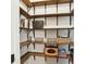 Walk in pantry with wooden shelving for storage at 105 Oakfield Way, Douglasville, GA 30134