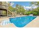 Inviting backyard pool area with a sparkling blue pool and comfortable lounge seating at 105 Oakfield Way, Douglasville, GA 30134