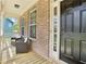 Inviting front porch with brick accents and cozy seating area at 105 Oakfield Way, Douglasville, GA 30134