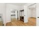 Walk-in closet with wood-look floors, white walls, and clothing racks at 105 Oakfield Way, Douglasville, GA 30134
