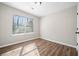 A bedroom featuring flooring, a window with blinds, and natural light at 109 Beaver Dam Rd, Peachtree City, GA 30269