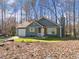 Charming single-Gathering home with blue siding, attached garage, and a well-kept lawn at 109 Beaver Dam Rd, Peachtree City, GA 30269
