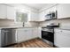 Updated kitchen with stainless steel appliances, granite countertops, and modern fixtures at 109 Beaver Dam Rd, Peachtree City, GA 30269