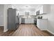 Modern kitchen with stainless steel appliances, white cabinetry, and updated countertops at 109 Beaver Dam Rd, Peachtree City, GA 30269