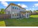 Spacious backyard with large lawn and covered patio, perfect for enjoying outdoor living and entertaining at 3048 Level Grove Ln, Dacula, GA 30019