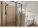 Spacious shower and tub in a bright bathroom with tiled walls at 3048 Level Grove Ln, Dacula, GA 30019