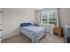 Cozy bedroom with natural light and a white dresser offering ample storage space at 3048 Level Grove Ln, Dacula, GA 30019