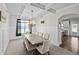 Elegant dining room with decorative lighting and wainscoting details at 3048 Level Grove Ln, Dacula, GA 30019