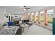 Bright and open living room with a wall of windows, and an adjacent kitchen at 3048 Level Grove Ln, Dacula, GA 30019