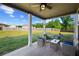 Covered patio with comfortable seating arrangement, offering a cozy outdoor space for relaxation and entertainment at 3048 Level Grove Ln, Dacula, GA 30019