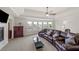 Comfortable sitting area with large windows, fireplace and plush seating at 3048 Level Grove Ln, Dacula, GA 30019
