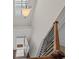 A carpeted staircase with wrought-iron balusters, leading to the upper floor at 3048 Level Grove Ln, Dacula, GA 30019