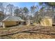 This large backyard features a storage shed, mature trees, and ample space for outdoor activities at 4186 Argonne Dr, Villa Rica, GA 30180