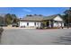 Inviting clubhouse exterior with manicured landscaping, ample parking, and golf carts nearby at 4186 Argonne Dr, Villa Rica, GA 30180