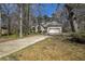 Charming single-Gathering home with a two-car garage, well-maintained lawn, and private driveway at 4186 Argonne Dr, Villa Rica, GA 30180
