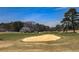 Scenic golf course view with lush green grass, mature trees, and a sand trap at 4186 Argonne Dr, Villa Rica, GA 30180