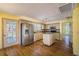 Kitchen featuring stainless steel appliances, an island, light wood cabinets, and hardwood floors at 4186 Argonne Dr, Villa Rica, GA 30180