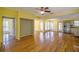 A spacious living room with wood floors, yellow walls, and natural light from the many bright windows at 4186 Argonne Dr, Villa Rica, GA 30180