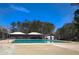Community pool with clear blue water, covered seating, and well-maintained surrounding area at 4186 Argonne Dr, Villa Rica, GA 30180