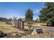 The Plantation Golf & Country Club sign with lush landscaping in a well-maintained community at 4186 Argonne Dr, Villa Rica, GA 30180