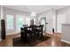 Bright dining area features modern light fixture, wood floors, and neutral wall paint at 1731 Pryor Sw Rd # 108, Atlanta, GA 30315