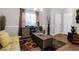 Charming living room with decorative rug, window, couch, and cabinet with adjacent storage at 1731 Pryor Sw Rd # 108, Atlanta, GA 30315