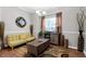 Cozy living room featuring decor, rug, natural lighting, cabinet, and comfortable seating at 1731 Pryor Sw Rd # 108, Atlanta, GA 30315