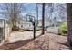 Expansive backyard featuring a basketball court, deck, and storage shed, perfect for outdoor activities at 1861 Dyer Cir, Atlanta, GA 30341