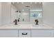 Bathroom vanity featuring double sinks, white countertop, and modern fixtures at 1861 Dyer Cir, Atlanta, GA 30341