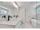 Bright bathroom with double sinks, marble floors, and a soaking tub at 1861 Dyer Cir, Atlanta, GA 30341