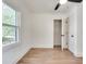 Bright bedroom features hardwood floors, closet, and a large window with natural light at 1861 Dyer Cir, Atlanta, GA 30341