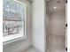 Bright bedroom with view to backyard basketball court and walk-in closet at 1861 Dyer Cir, Atlanta, GA 30341