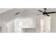 Bonus room with a ceiling fan, lots of light, carpet and a vaulted ceiling at 1861 Dyer Cir, Atlanta, GA 30341