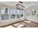 Bright dining room features modern chandelier and large windows offering natural light at 1861 Dyer Cir, Atlanta, GA 30341