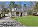 Quaint home with a covered porch and dormer windows and long driveway at 1861 Dyer Cir, Atlanta, GA 30341