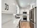 Modern kitchen with stainless steel appliances, quartz countertops, white cabinets, and a stylish faucet at 1861 Dyer Cir, Atlanta, GA 30341