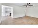Open-concept living room, leading to a modern kitchen with stainless steel appliances at 1861 Dyer Cir, Atlanta, GA 30341