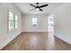 Bright living room with beautiful hardwood flooring, ceiling fan and natural light at 1861 Dyer Cir, Atlanta, GA 30341