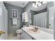 Bathroom with single sink vanity, hexagon tile floor, and shower/tub combo at 4519 Glenforest Ne Dr, Roswell, GA 30075
