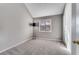 Cozy carpeted bedroom with soft natural light and modern minimalist floor lamp at 4519 Glenforest Ne Dr, Roswell, GA 30075