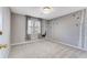 Neutral bedroom features nature-themed wall art, plush carpet, and a bright window at 4519 Glenforest Ne Dr, Roswell, GA 30075