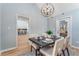 Cozy dining room with natural light, modern light fixture, and seating for four at 4519 Glenforest Ne Dr, Roswell, GA 30075