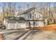 Contemporary home with a two-car garage and modern architecture in a wooded setting at 4519 Glenforest Ne Dr, Roswell, GA 30075