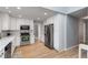 Bright kitchen with stainless steel appliances, white cabinets, and designer backsplash at 4519 Glenforest Ne Dr, Roswell, GA 30075