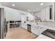 Modern kitchen featuring white cabinets, stainless steel appliances, and a convenient layout at 4519 Glenforest Ne Dr, Roswell, GA 30075