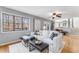 Comfortable living room features hardwood floors and a sun-drenched window with views of natural surroundings at 4519 Glenforest Ne Dr, Roswell, GA 30075
